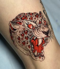 a close up of a person's leg with a tattoo design on the thigh