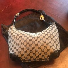 Absolutely Authentic Gucci Black And Grey Gucci Hobo Bag With Patent Leather Handle And Corners. Purchased In Naples Italy In 2003. This Style Is Rare And I Have Never Really Seen Anyone Else With It. There Is A Small Scrape In The Canvas (See Photo) On On Side Approx 3.5” Long By 1/2” Wide. I Am Not Sure How That Happened. Other Than That The Bag Is In Very Good Condition And Interior Is Mint. Comes With Dustbag. Elegant Pre-owned Tote Shoulder Bag, Elegant Pre-owned Shoulder Bag, Designer Pre-owned Monogram Canvas Shoulder Bag, Designer Monogram Canvas Shoulder Bag, Designer Monogram Canvas Pre-owned Shoulder Bag, Pre-owned Elegant Top Handle Bag, Elegant Pre-owned Top Handle Bag, Elegant Pre-owned Monogram Canvas Bag, Black Gucci Monogram Canvas Shoulder Bag