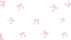 pink bows are flying in the air on a white background