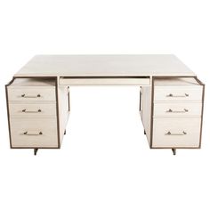 a white desk with three drawers on it