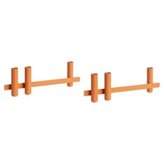 two orange wooden pegs on a white background