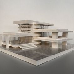 an architectural model of a house on display