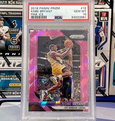 a basketball card is on display in a clear case