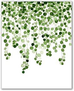 green leaves are hanging from the ceiling in front of a white background with black dots