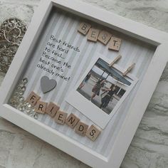 a white frame with words and pictures attached to it