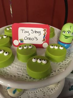 there are some toy story oreos on the plate with green eyes and googly eyes