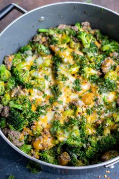 a pan filled with broccoli covered in cheese