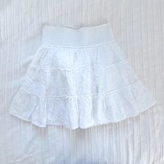 American Eagle White Eyelet Tiered Ruffle Mini Skirt Smocked Waistband, Stretchy Size Xs Never Worn, Tag Has Been Ripped Off But Plastic Thing Is Still There It Is Brand New Is Lined Underneath, But No Shorts It Is A Skirt So Cute For Summer / Bridal Things Feminine White Mini Skirt With Elastic Waistband, White Tiered Mini Skirt With Elastic Waistband, White Mini Skirt With Elastic Waistband, White A-line Flowy Mini Skirt, White Ruffled Short Mini Skirt, Skirts Flowy, Ruffle Mini Skirt, White Eyelet, White Skirts