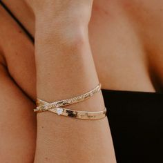 How stunning and unique is our Capulet Gold Bracelet? The herringbone bracelet is 7 mm of liquid gold with a 5mm cubic zirconia set in the middle of the herringbone. Pair it with our Capulet Gold Herringbone and Heart Necklace and Capulet Gold Herringbone and Heart Ring for the complete brilliant look. Final Sale- No returns or exchanges. Composition-14kt Gold plating over brass. Cubic Zirconia. Length- 6.5 inch with a 1 inch extender. Width-7mm chain and 5mm cubic zirconia heart. Lobster clasp. Gold Bangle Bracelets For Promise, Flexible Gold Cuff Bracelet As Gift, Gold Tarnish Resistant Bracelets For Promise, Gold Tarnish-resistant Bracelets For Promise, Gold Promise Bracelet, Gold Plated Stackable Bracelets For Anniversary, Gold-plated Stackable Bracelets For Anniversary, Stackable Gold-plated Bracelets For Anniversary, Gold Promise Bangle Name Bracelet