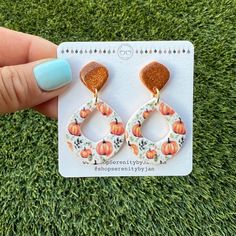 Our reverse glitter Pumpkin earrings are a nice addition to your fall wardrobe.  If you like the print more or the glitter, either pair is perfect for you.  Our dangles have a resin secured post backing and measure 1.25 inches in length by half an inch wide. Earring care cards are included with each earring. Quantity on these is limited. Get them while you can. Fall Orange Earrings As Gift, Orange Earrings For Fall Season Gift, Fall Season Gift Dangle Earrings, Autumn Earrings, Glitter Pumpkins, Thanksgiving Pumpkin, West Covina, Pumpkin Earrings, Fall Earrings