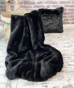 Another new addition to our range of low-priced, plain faux fur throws. After listening to comments from our customers who wanted a plain black but not as long-haired as the Black Bear, this new design will surely become very popular. Easily maintained and suitable for bedroom, sofa or chair; and cats and dogs adore it so why not spoil them and get one of the smaller sizes just for them. If your throw is intended for use on white or very light leather furniture, please choose plain short fur or Blankets For Winter, Grey Fur, Fuzzy Blanket, Black Panthers, Fur Blanket, Fur Throw, Faux Fur Throw, Luxury Blanket, Decorative Blankets