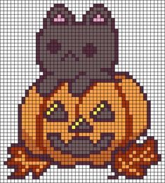 a cross stitch pattern with an image of a cat in a pumpkin costume