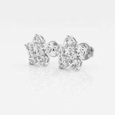 Feminine and dainty, these flower shaped studs are your perfect everyday pair. Wear it as your main pair of earrings or stack them with hoops to have some fun. Classic White Flower Shape Cluster Earrings, Classic White Flower-shaped Cluster Earrings, Classic Diamond Cluster Earrings With Flower Shape, Classic Diamond Flower Cluster Earrings, Anniversary Flower-shaped Cluster Earrings In Fine Jewelry Style, Classic Brilliant Cut Flower Earrings, Anniversary Flower Shaped Cluster Earrings Fine Jewelry, Anniversary Flower Shaped Cluster Earrings, Flower-shaped Cluster Earrings With Diamond Accents