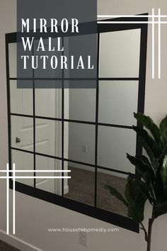 a mirror sitting on top of a white wall next to a potted green plant