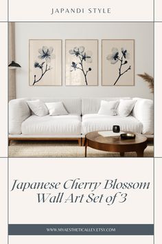 the japanese cherry blossom wall art set of 3 is displayed in front of a white couch