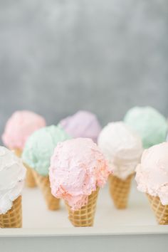 several ice cream cones with different colors in them