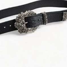 Elevate your style with this black leather belt, featuring a beautifully detailed silver buckle that adds a touch of timeless elegance to any ensemble. Handcrafted in Greece from high-quality genuine leather, this belt stands out with its unique textured design and refined aesthetics. It is 4 cm (1.6 inches) in width and offers style and comfort, making it an ideal accessory for various occasions. The intricate silver buckle enhances the belt's luxurious appeal, ensuring it becomes a standout pi Luxury Designer Silver Belts, Elegant Leather Belt With Buckle Closure, Luxury Silver Belt With Buckle Closure, Formal Adjustable Belts With Buckle Closure, Adjustable Formal Belt With Buckle Closure, Adjustable Belt With Buckle Closure For Formal Wear, Black Leather Belt Buckles With Silver Buckle, Silver Leather Belt With Buckle Closure, Elegant Silver Leather Belt Buckles