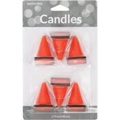 three orange plastic cones in packaging