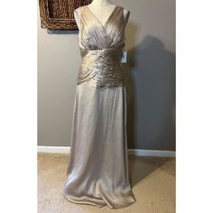 This Pretty Dress Is From Calvin Klein In A Misses Size 10. Color: Blv Beige Silver. (Light Champagne Gold In Color.) Rich Textured Fabric. Fully Lined, Made Of Polyester With A Faux Silk Feel. Has A Smooth Fit With Back Zipper. Built In Bra With Boned Support. Unstretched, Measured From Seam To Seam Across The Front: Bust Is 18 Inches Across Waist Is 15.5 Inches Across Hips Are 21 Inches Across Length Is 60 Inches Long New With Tags. From A Smoke Free Home. Thanks For Shopping With Me. Elegant Calvin Klein Evening Maxi Dress, Calvin Klein A-line Formal Dresses, Glamorous Gold V-neck Maxi Dress, Navy Blue Formal Dress, Soft Pink Dress, Elegant Calvin Klein Sleeveless V-neck Dress, Calvin Klein Fitted Sleeveless V-neck Dress, Floral Tea Dress, A Line Bridal Gowns