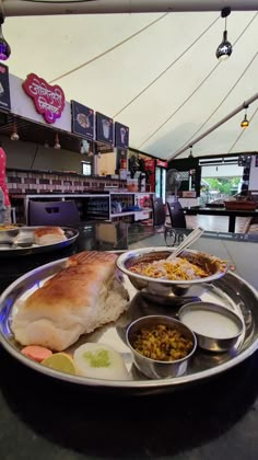 a large plate with food on it sitting on a table in front of a counter