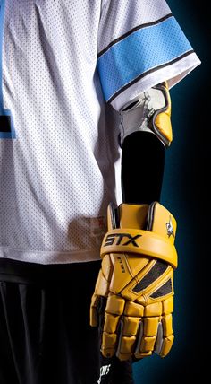 the catcher's mitt is held in front of his uniform and jersey shirt