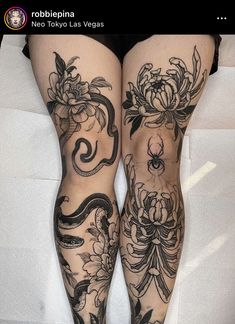 a woman's legs with tattoos on them and flowers in the bottom right leg