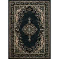 a black rug with an ornate design on the center and bottom, in front of a white background