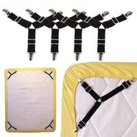 four black and white suspenders are attached to the back of a baby crib