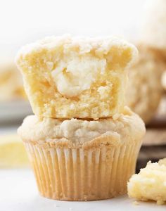 a muffin with a bite taken out of it sitting on top of another muffin