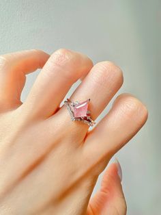 This gorgeous, timeless ring features our favorite Strawberry Quartz design and hand picked crystals.  This is a 2 piece set.  Libra is the zodiac sign of strawberry quartz. For those who are born from September 23 to October 22, things you would want to let go, such as possessiveness and indecisiveness, will disappear with the gem. The romantic within you will wake up and find opportunities to seek love when the stone is by your side. the crystal awakens new talents such as music and painting or writing. ✦ DETAILS ✦ ✧ Handcrafted  ✧ 1.25 Carat center stone ✧ Strawberry Quartz and crystals  ✧ Sizes 3.75-11.25 ✧ This ring will arrive ready to gift in a Kherish Jewelry Pouch. ✧ PRE-ORDER: Items that are preorder only will ship within 10-15 business days.  You will receive an email with the u Pink Morganite Rings For Gift, Pink Morganite Gemstone Jewelry, Pink Morganite Rings Perfect As Gifts, Pink Stone Ring Jewelry, Pink Stone Jewelry For Anniversary, Adjustable Pink Crystal Ring For Anniversary, Pink Rose Quartz Jewelry With Stones, Adjustable Pink Crystal Birthstone Ring, Pink Stone Rings As Gift