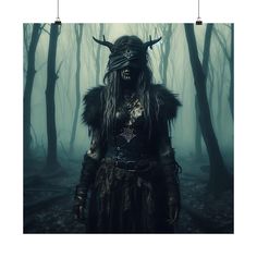 a man with horns and long hair standing in the middle of a forest wearing a horned mask