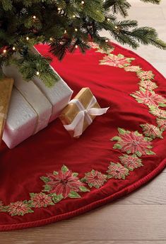 a christmas tree skirt with presents under it