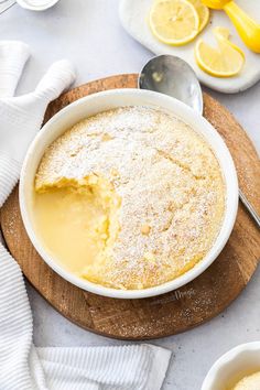 a bowl of lemon pudding on a cutting board