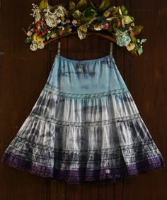 Gorgeous 1960's 6 tiered half slip skirt! The color is a light teal around the hips and fades to shades of gray in the middle with the tip of the skirt in a plum purple.  Full sweep (102 inch hem) A-frame skirt with 6 layers of lace.  This one is a really cute skirt. The fabric is a high quality silky soft satin Dacron polyester 45% / nylon 31% / cotton 34% blend Tag has been cut but is best for a size medium due to the looseness of the elastic band.  Opaque body, would make a cute skirt to wear out. The elastic in the waist is not in the best shape.  It does have some hold but not light the new stuff.   The elastic band is visibly damaged on the back right side (see pic). Pink 5 petal organza chiffon flower at the hem with a faux pearl in the center.  Shown on a size S/M dress form with a Spring Dresses With Lace Patchwork And Flowy Skirt, Summer Dresses With Lace Patchwork And Flowy Skirt, Spring Dresses With Layered Flared Hem, Spring Dresses With Layered Flared Skirt, Spring Fitted Skirt With Lace Patchwork, Fitted Lace Patchwork Skirt For Spring, Spring Flared Dress With Layered Hem, Summer Dresses With Ruffle Hem And Full Skirt, Flowy Tiered Skirt Dress With Lace Trim