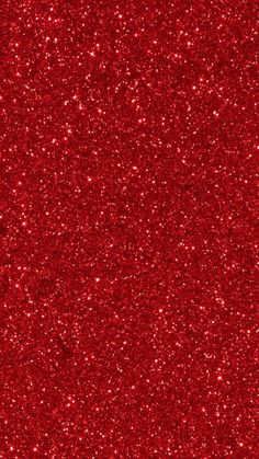 a red glitter background with lots of small sparkles