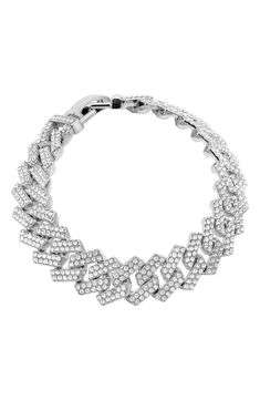 Pavé cubic zirconia bring glamorous sparkle to a curb-chain bracelet with a polished rhodium-plated finish. 8 1/2" length; 1/2" width Fold-over clasp White rhodium plate/cubic zirconia Imported White Gold Cubic Zirconia Chain Link Bracelet, Silver Cuban Link Tennis Bracelet For Formal Occasions, Iced Out Crystal Chain Link Jewelry, Formal Cubic Zirconia Chain Link Bracelets, Silver Cubic Zirconia Chain Tennis Bracelet, Elegant Silver Iced Out Cuban Link Bracelet, Elegant Silver Iced-out Cuban Link Bracelet, Silver Cubic Zirconia Chain Bracelet With Bling, Glamorous Silver Cubic Zirconia Crystal Bracelet