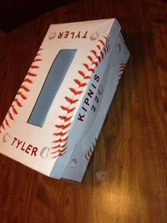 a baseball themed birthday cake with the number 1 on it's front and side