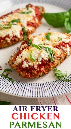 chicken parmesan pizza on a white plate with basil leaves and text that reads air fryer chicken parmesan pizza