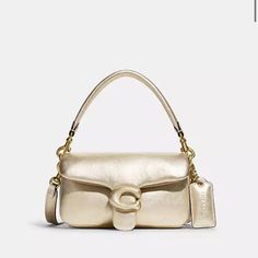 Nwt Coach Holiday 2022 Edition Pillow Tabby 18 Metallic Soft Calf Leather Inside Multifunction Pocket Snap Closure, Leather Lining Detachable Handle With 4" Drop Detachable Long Strap With 21 1/2" Drop For Shoulder Or Crossbody Wear 7 1/4" (L) X 4" (H) X 2 1/2" (W) Style No. C7876 Coach Pillow Tabby, Coach Pillows, Tabby Shoulder Bag, Coach Tabby, Coach 1941, Leather Pillow, Bags Coach, Signature Hardware, Metallic Leather