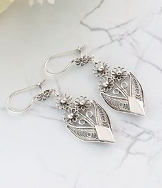 "925 Sterling Silver Bunch of Flower Design Dangle Earrings Artisan Made Filigree Art Floral Women Earrings The length of the is 2.15\" and width is 1.38\". The weight is 5.80 gr. Comes with velvet pouch and luxurious gift box Filigree is made of delicate metal strands that have been skillfully fashioned to create an outstanding combination of old and modern art. Originating in Mesopotamia, Anatolia. It is made of delicate metal strands that have been skillfully fashioned to create an outstandin Sterling Silver Flower Earrings, Gemstone Drop Earrings, Silver Flower Earrings, Filigree Jewelry, Women Earrings, Rose Quartz Gemstone, Sterling Silver Filigree, Silver Work, Mesopotamia