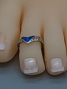 A Unique and Attractive Toe Ring...Chevron with a Blue Opal in a Sterling Silver .925 with a Rhodium coating for added protection! A new look for an old classic. Rings are very well crafted and sturdy and great for any occasion. Will not tarnish or turn color. An Elegantly designed ring, great for midi, stacking or any other finger So comfortable you won't know you are wearing them! No pinching like adjustable rings.. Go From Ordinary to Extraordinary! You won't believe the difference that a cor Adjustable Silver Opal Toe Ring, Elegant Silver Opal Toe Ring, Silver Opal Toe Ring For Wedding, Koa Wood Ring, Classic Rings, Sterling Silver Toe Rings, Blue Opal Ring, White Opal Ring, Silver Toe Rings