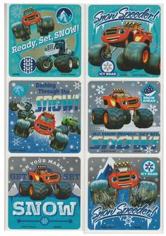 four magnets with monster trucks on them in blue and orange colors, each featuring snowflakes