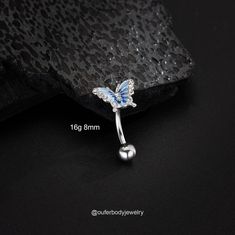 the butterfly belly button ring is shown with measurements