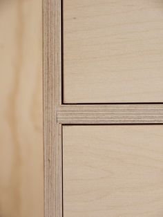 a close up view of some wood grains on a cabinet door with the bottom panel missing