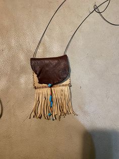 Medicine bag, all leather, turquoise beads Brown Beaded Tote Shoulder Bag, Beaded Brown Tote Shoulder Bag, Turquoise Hand Tooled Rectangular Shoulder Bag, Turquoise Hand Tooled Shoulder Bag For Everyday Use, Hand Tooled Turquoise Shoulder Bag For Everyday Use, Bohemian Leather Bags As Fashion Accessory, Turquoise Hand Tooled Everyday Bags, Turquoise Hand Tooled Bags For Everyday Use, Travel Brown Beaded Shoulder Bag