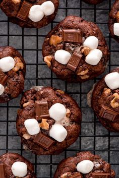 several chocolate cookies with marshmallows on a cooling rack