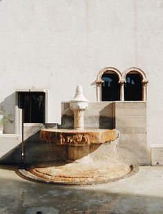 a water fountain in front of a building