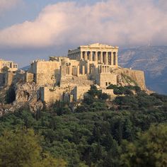 an ancient building on top of a mountain