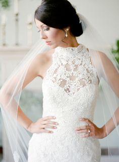 a woman wearing a wedding dress and veil