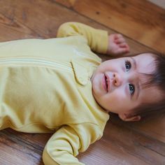 Designed to be all-day comfort from sleeping to playing, this cuddly and super soft one-piece is perfect for playtime, tummy time, and sweet dreams! The incredibly soft Zip Jumpsuit comes in two colors, yellow and mint. It is long sleeve and footed and comes with a nickel-free zipper on the front for super easy dressing. With its neck-to-ankle zipper down one leg, it is easy to dress or change diapers. There’s a snapped protection piece on the neck for the zipper for safety and comfort.Comes in Baby Gift Sets, Tummy Time, Unique Designers, Play Time, Sweet Dreams, Simple Dresses, Super Easy, Baby Gifts, Baby Face